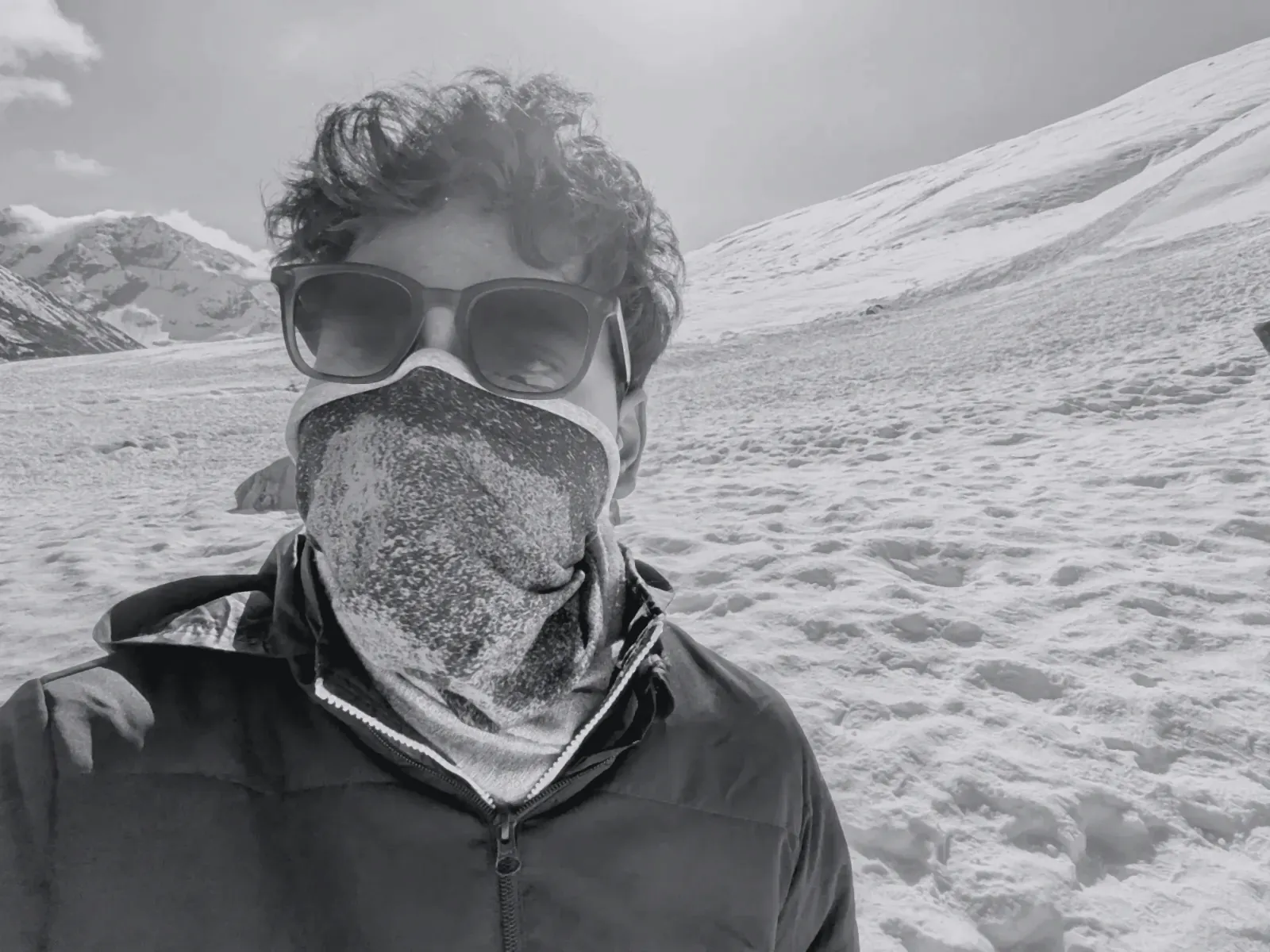 Aman in snow goggles and a neck gaiter, North Sikkim in winter (toned)